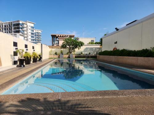 Pinagsama Apartment | Casa Antonio at Stamford McKinley Hill Unli Wi-Fi Near Piazza