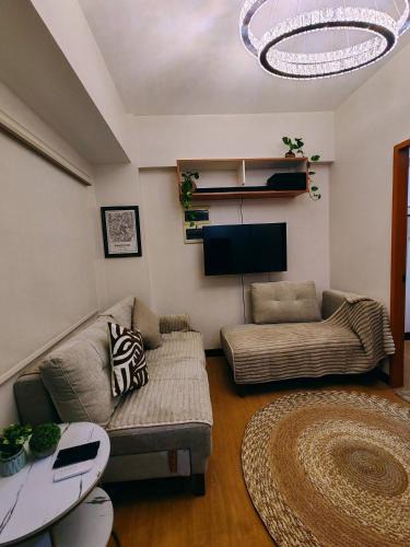 Cainta House | Charming 2BR Condo in Cambridge with WIFI, Smart TV