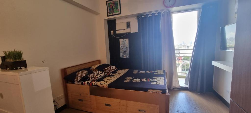 A. Bonifacio Apartment | Deluxe Studio Unit in QC for Staycation