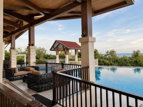 Dauis Apartment | DG Coastal Comfort near Alona Beach - Pool, Gym and Play area