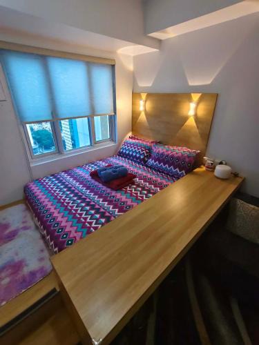 South Triangle Apartment | MPlace South Triangle Staycation in Quezon City by HARTCHOI
