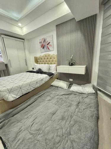 San Fernando Apartment | Rienzis Hiraya at Azure North - 11th floor studio with PS4,Washer,Mountain&Beach View