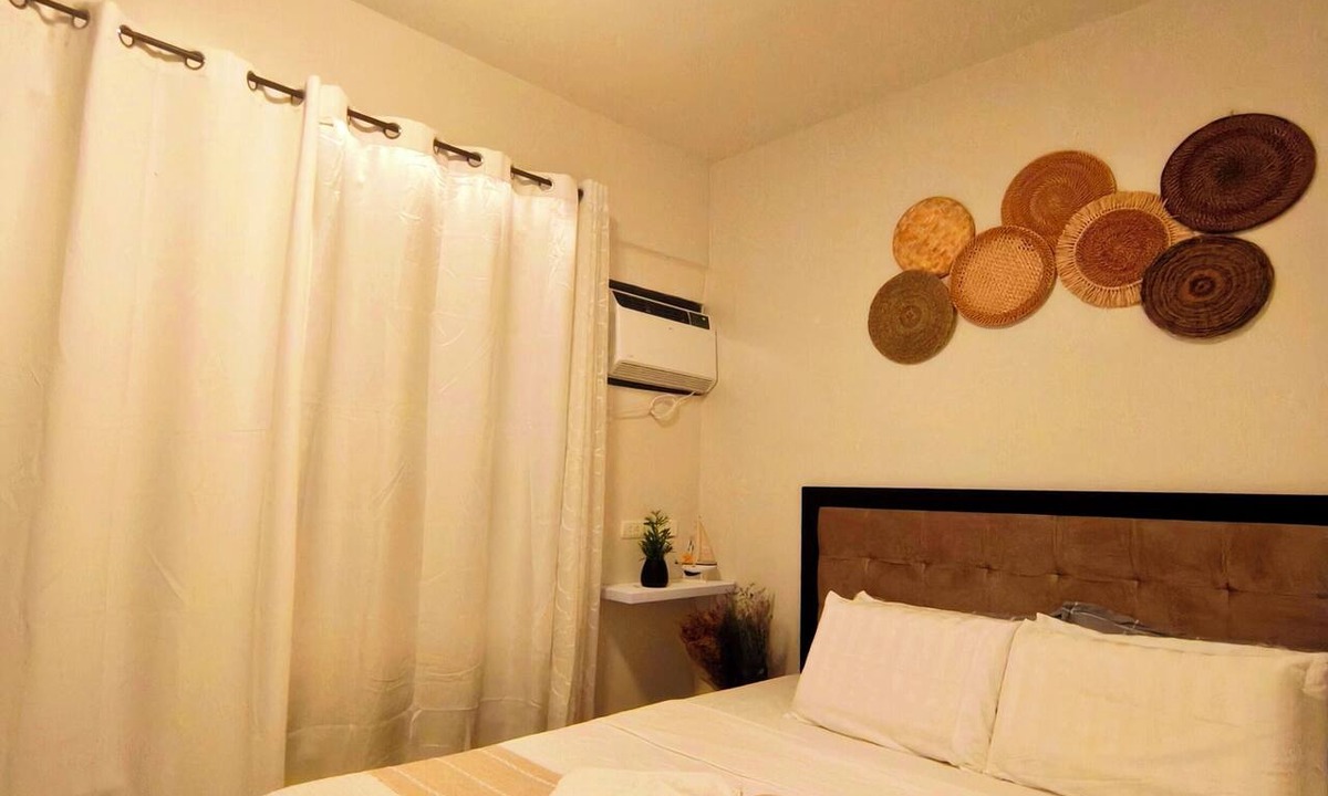 Dauis Condo | with balcony condo unit, near white beaches with pool, gym & breathtaking views