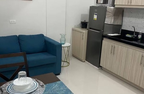 Basak Condo | 1 bedroom condo living room and kitchen sleeps 4 EARLY CHECK IN -LATE CHECK OUT