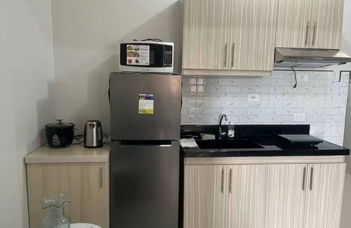 Basak Condo | 1 bedroom condo living room and kitchen sleeps 4 EARLY CHECK IN -LATE CHECK OUT