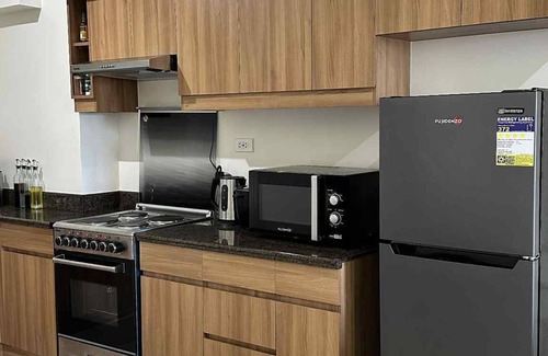 Forbes Park Condo | Aesthetic 2BR stay near BGC + Airport