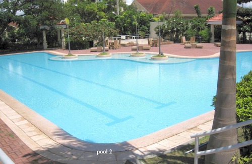 Lapu-Lapu Condo | new Lux. 2BR condo + 2 pools, woow oceanviews, Gym, Beach, behind Mactan Newtown