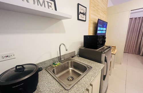 Tagaytay Condo | 1BR unit in Cool Suites, Wind Residences Tagaytay, smart tv and access to pool.
