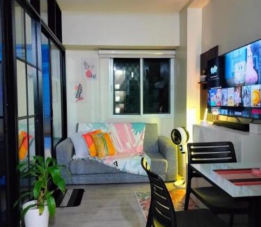 CSJDM Apartment | 2 BEDROOM CONDO close to SM Tungko BULACAN ideal for Family Queen bed on Bedroom 1 accessible to Bedroom 2 with sliding doors Free Wifi & Netflix to watch in a comfy sofa & twin bed Access to SWIMMING POOL entry is very affordable and kids get for free