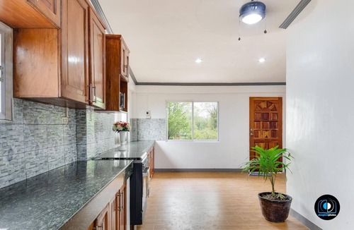 Loon House | A 5-minute walk fromseashore perfect for scuba diving and any water activity.