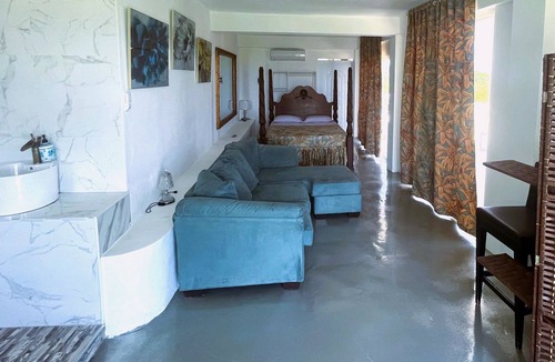 Cabrera Hotel | A suite with ocean view balconies, walk-in shower, pool, fire pit, & more!