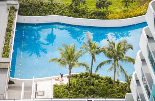 San Fernando Condo | Boho-Themed Studio with Pool View Balcony, Netflix, Karaoke & Boardgames