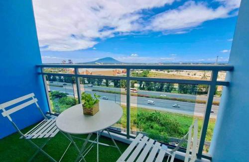 San Fernando Apartment | Casa Verde Studio at Azure North by THE BALI CORNER AT AZURE NORTH, Stylish, Spacious Balcony with Beautiful View of Mt Arayat