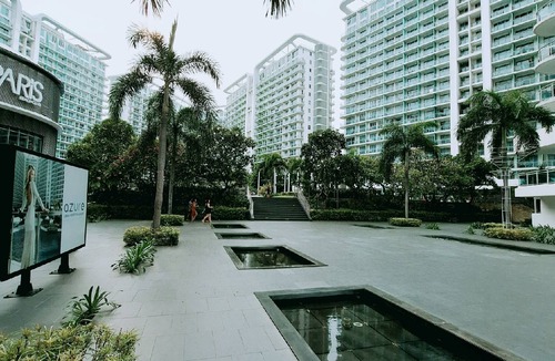 Taguig Condo | Chic 2-bedroom condo with AC, WiFi in enchanting Parañaque
