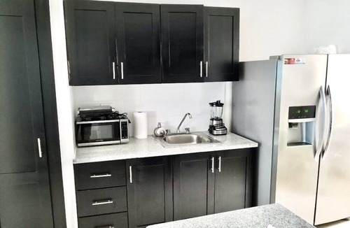 Licey al Medio Apartment | Comfortable apartment, 24/7 security, 8 minutes from the airport.