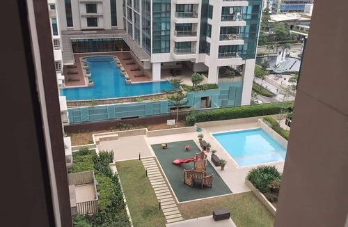 Makati Apartment | Cozy 1-bedroom apartment facing amenities with WiFi in upscale Uptown BGC Taguig