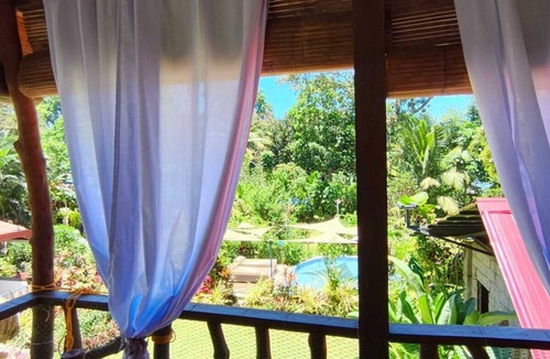 Mambajao House | Cozy 2-bedroom house in welcoming Mambajao with AC