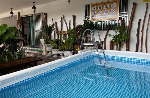 Hulu Selangor House | Cozy mountain jungle wood home with Kid Pool