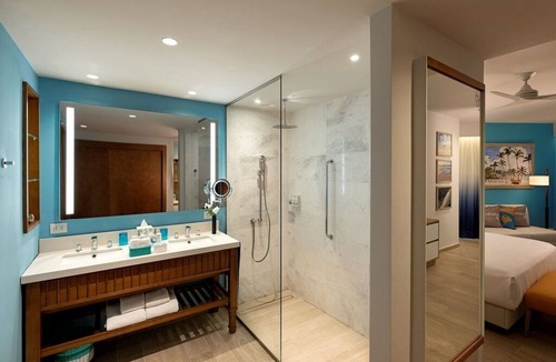 Punta Cana Hotel | Elegant Art Suite: Freestanding Tub, Rainforest Showers, and Premium Benefits