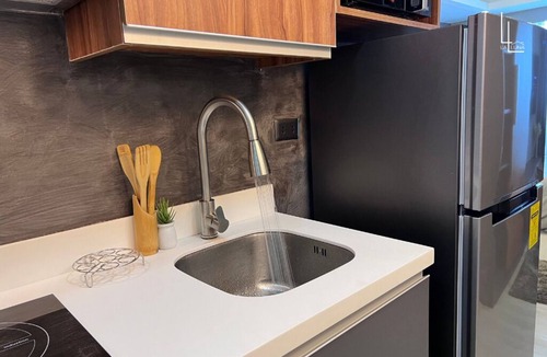 San Fernando Condo | Industrial-Themed Studio with Mt. Arayat View, Instax, Netflix & Karaoke