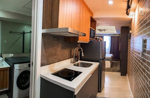 San Fernando Condo | Industrial-Themed Studio with Mt. Arayat View, Instax, Netflix & Karaoke