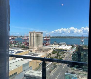 North Reclamation Area Apartment | La Maria Rentals - Cozy 2 Double Beds with Balcony, Walk to SM Mall Cebu