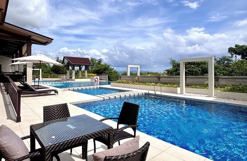 Dauis Condo | Peaceful 1-bedroom condo with access to pool, gym, and playground in Bohol