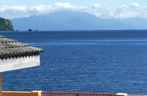 Calapan Condo | Relaxing beach side condo with mountain and island views.