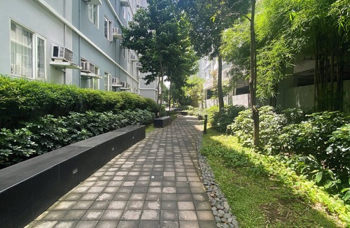 Novaliches Condo | Spacious Comfort: Two bedrooms & large living space ideal for families friends