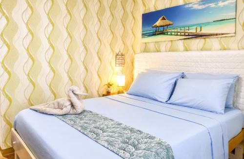 Mactan Export Processing Zone Apartment | Stay & Fly at Amani Grand Resort Residences with Pool Gym Netflix Fast WiFi 3 Guests
