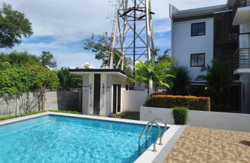 Talisay Apartment | TriG Place AlmondDrive near SM Seaside with Wifi Netflix pool & parking