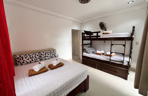 Morong Villa | Triple M Vacation Villas - Yellow house