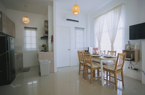 Dauis Villa | Villa Serena - Cozy 3-bedroom home complete full kitchen and communal pool
