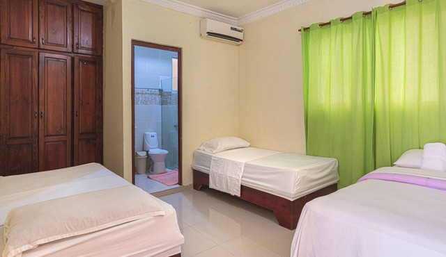 1-Bedroom Apartment with 3 Beds & Private Balcony Near SDQ Airport Fast Wi-F in Santo Domingo Este
