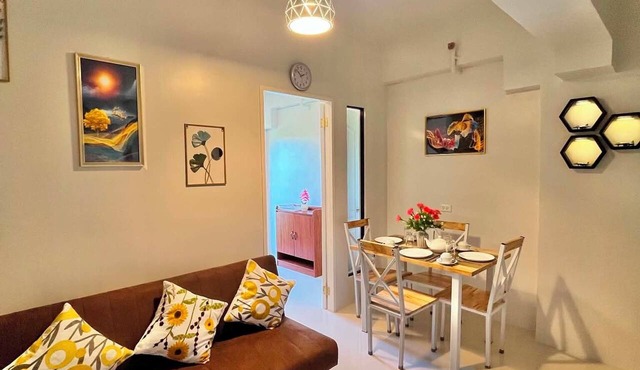 Brand new condo with free access to parking 5 minute walk to white sand beach in Dauis