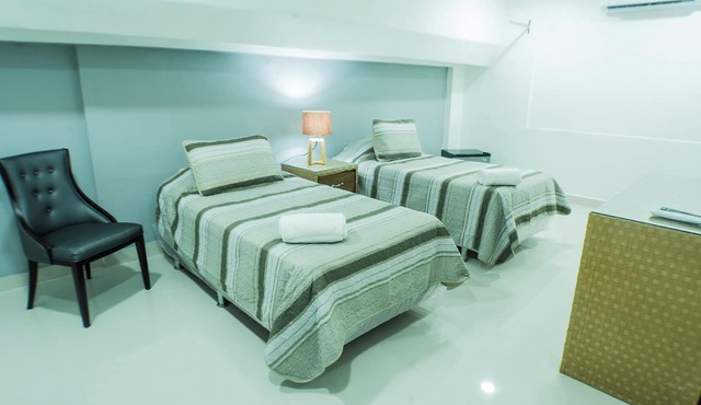 Cozy 1-bedroom hotel in serene Santo Domingo with AC downtown in Santo Domingo