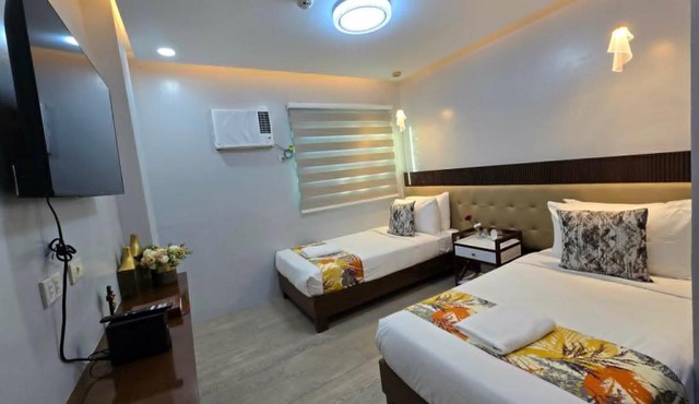 J Spazio Apartelle and Cafe