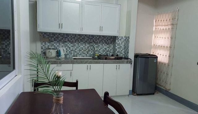 LoveNest- cozy place with swimming pool,12 min to the beach close to everything. in Daet