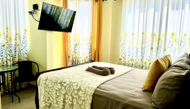 Romantic Hispanic 304 private room with refrigerator and dining area. in Higüey