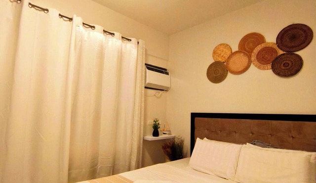 with balcony condo unit, near white beaches with pool, gym & breathtaking views in Dauis