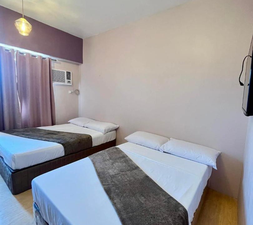 North Reclamation Area Apartment | Deluxe Twin Bed at Sunvida Tower across SM CITY