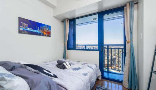 One-Bedroom Apartment with Balcony and City View