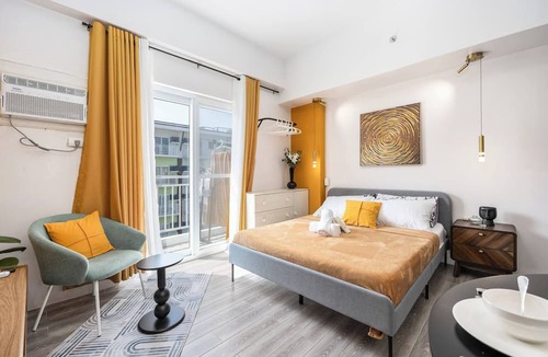 Mactan Export Processing Zone Condo | Stylish Condo 3-minutes to Airport, Poolview at Amani Grand Resort Residences