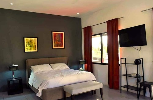 Dauin Villa | overlooking villa with breathtaking sunrises a modern kitchen big swimming pool