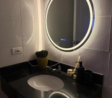Moonwalk Apartment | Modern lounge 2BR Pool & Netflix Near airport
