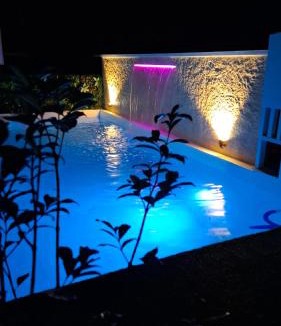 Puerto Princesa Apartment | A Touch of Pink - Secret Tropical Retreat with Pool & Mountain Views - Underground River, Fireflies & Waterfalls