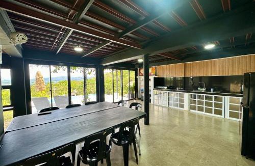 Siniloan House | Black Glasshouse with overlooking view