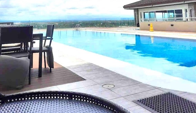 Condo w/ Direct Access To Mall, Pool, Gym, Wifi in Bacolod